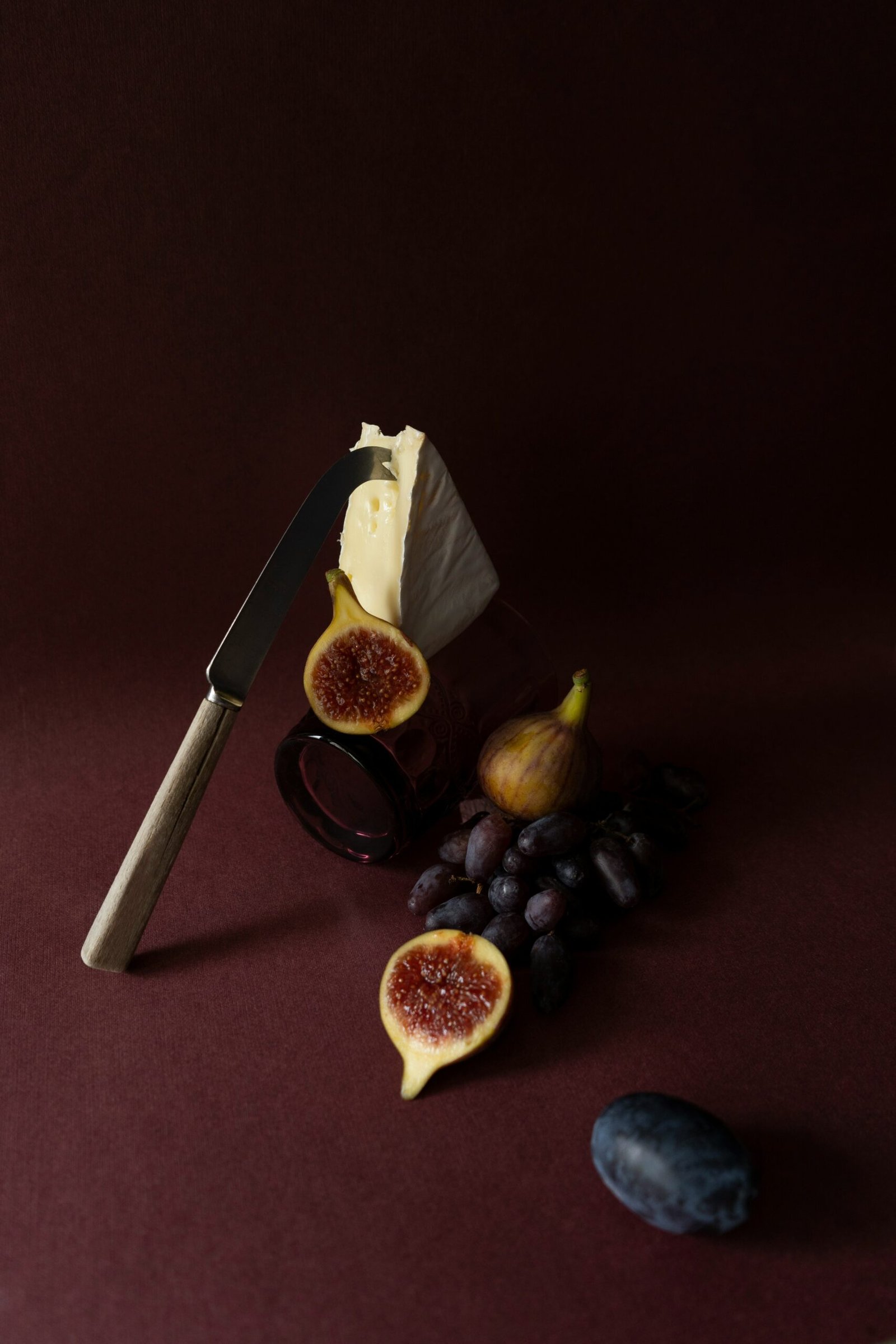 a knife and some fruit on a table